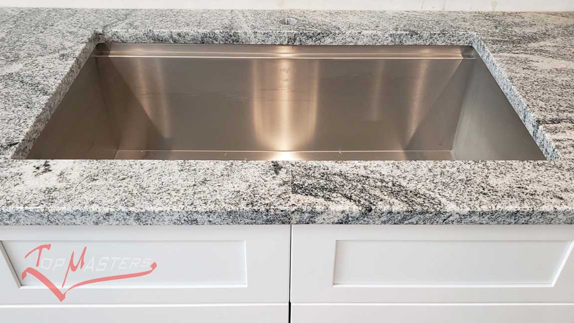 The sink cutout and nice edge make the kitchen countertop stand out.