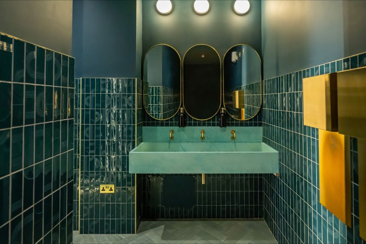 Phoenix Blue metro and brick wall tiles shown in a public bathroom taken in clays Birmingham